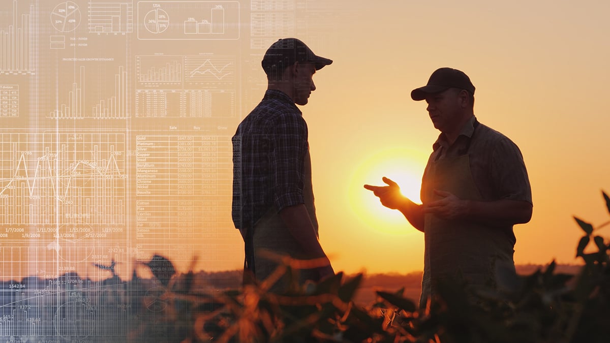 Farmers talking in field with data overlay