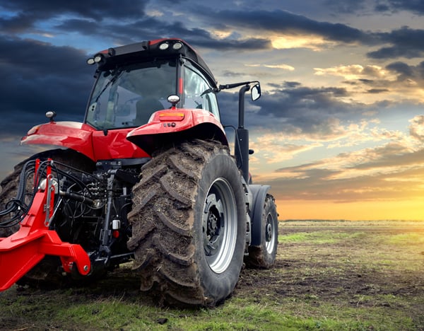 Red Tractor against a sunset