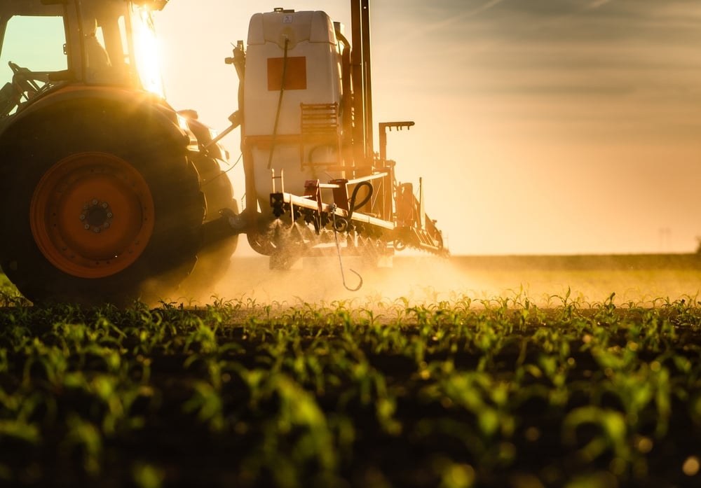 sprayer on corn field - shutterstock_2155752301