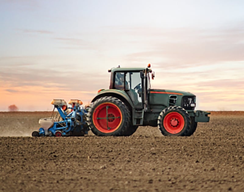 Tractor in ploughed field