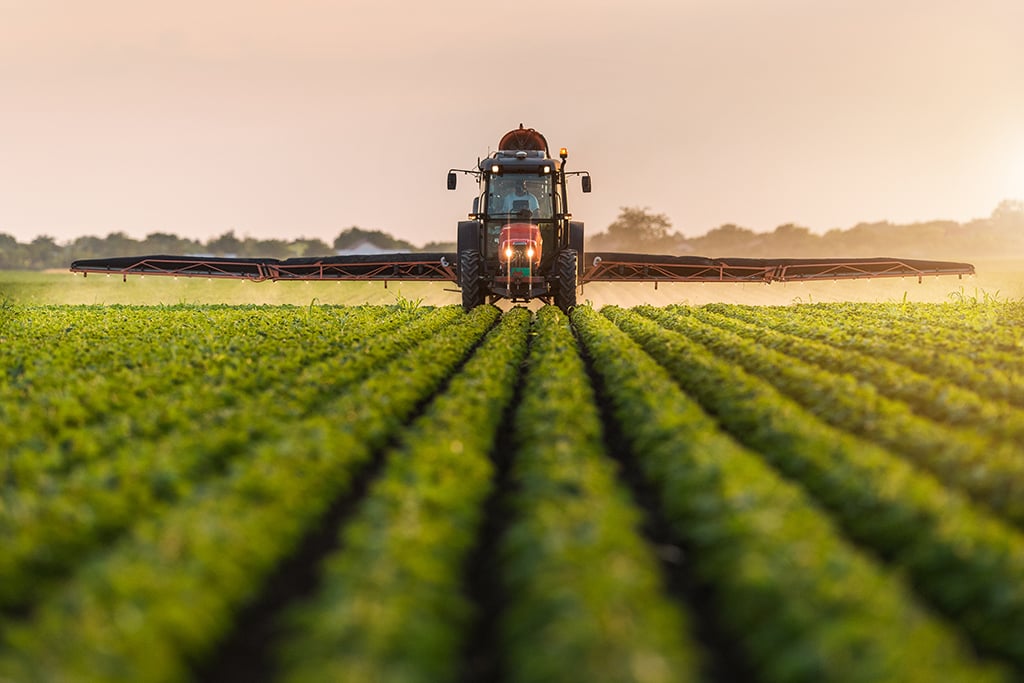 tractor spraying soybean